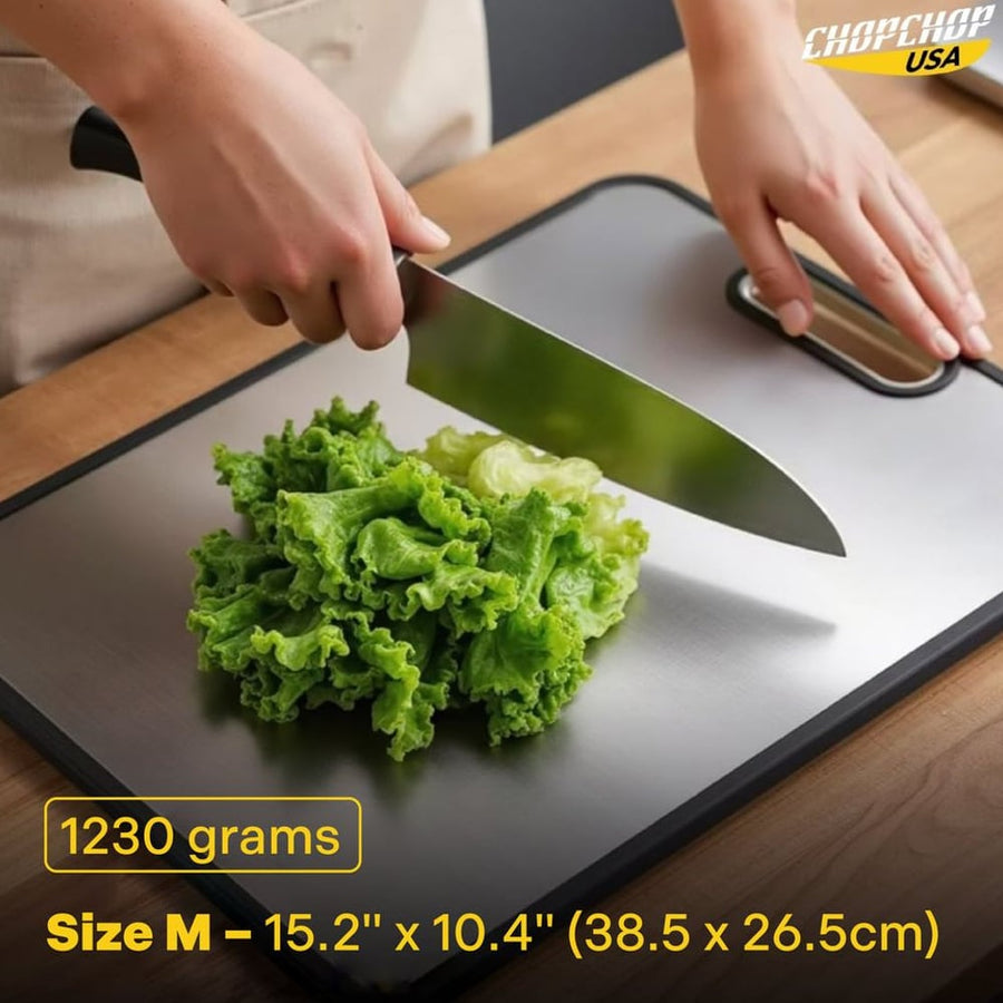 Chef knife cutting greens on the Medium titanium board