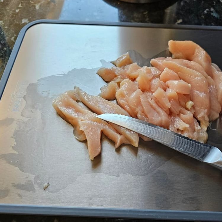 Chicken sliced on the ChopChop USA titanium cutting board