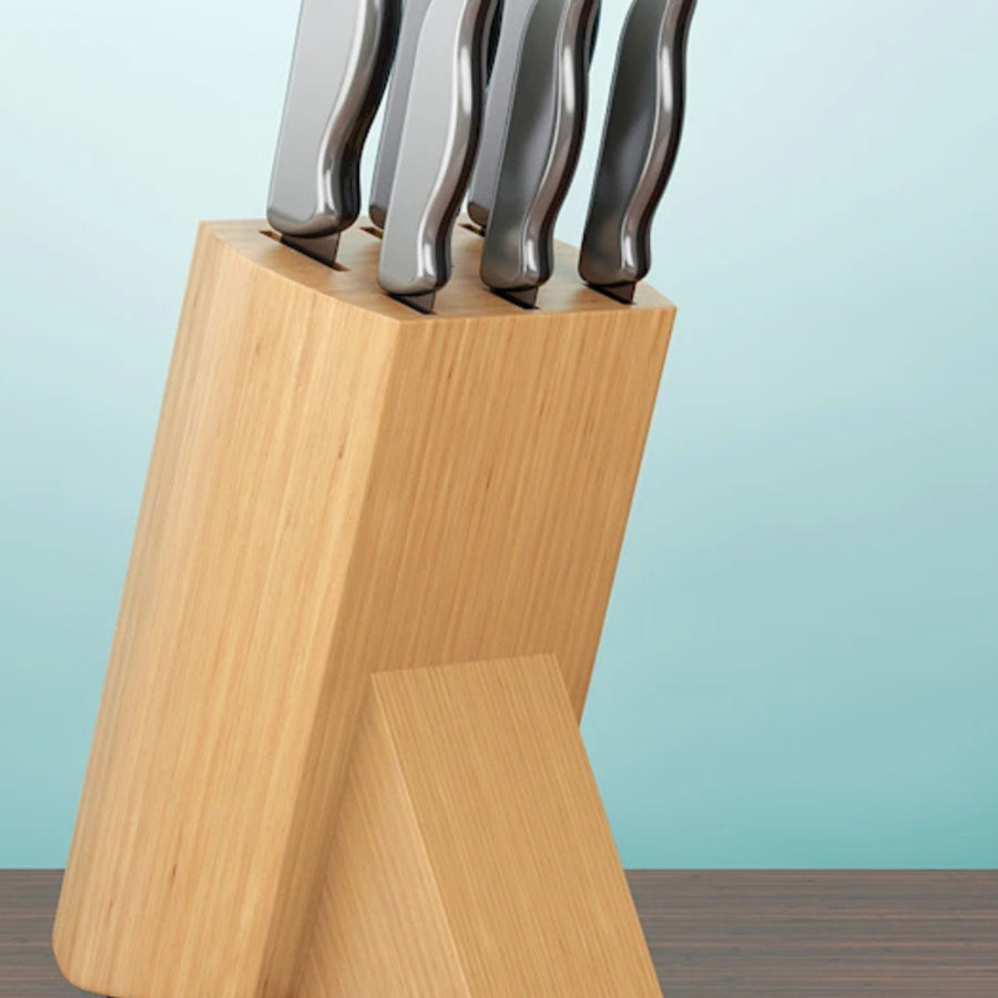Basic slotted wooden knife block crammed with knives