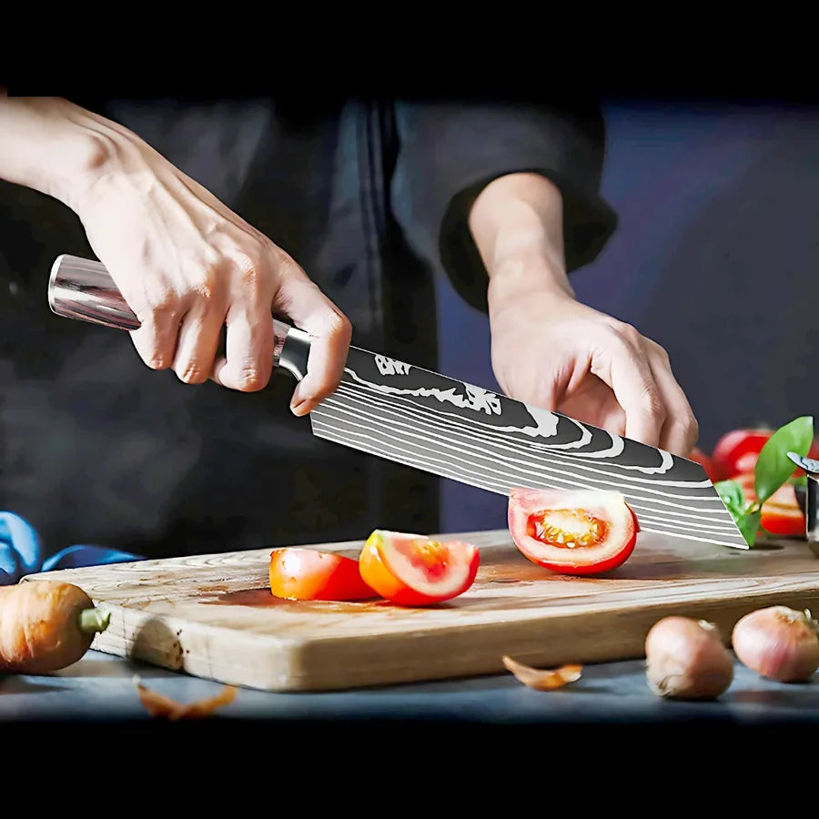 Kiritsuke knife slicing tomatoes on a wooden board