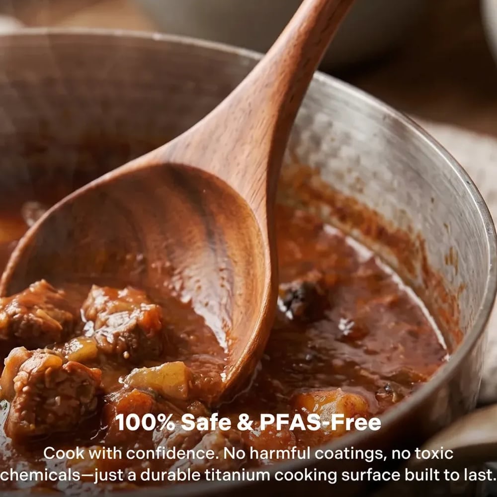 Wooden spoon stirring a meatball sauce in the titanium deep pan