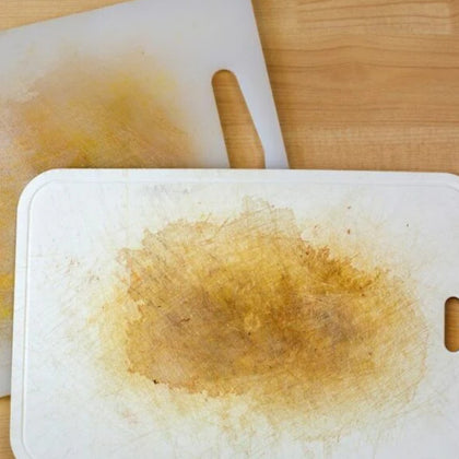 Stained, scratched white plastic cutting boards - worn plastic board hygiene