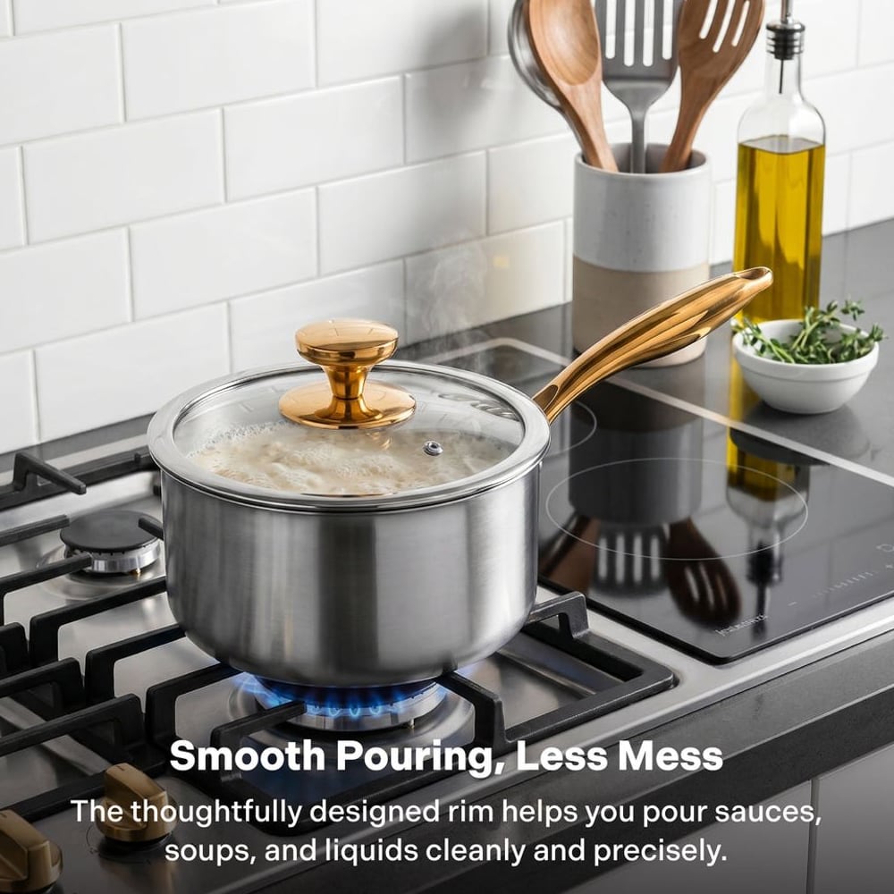 Titanium saucepan with glass lid on a gas stove