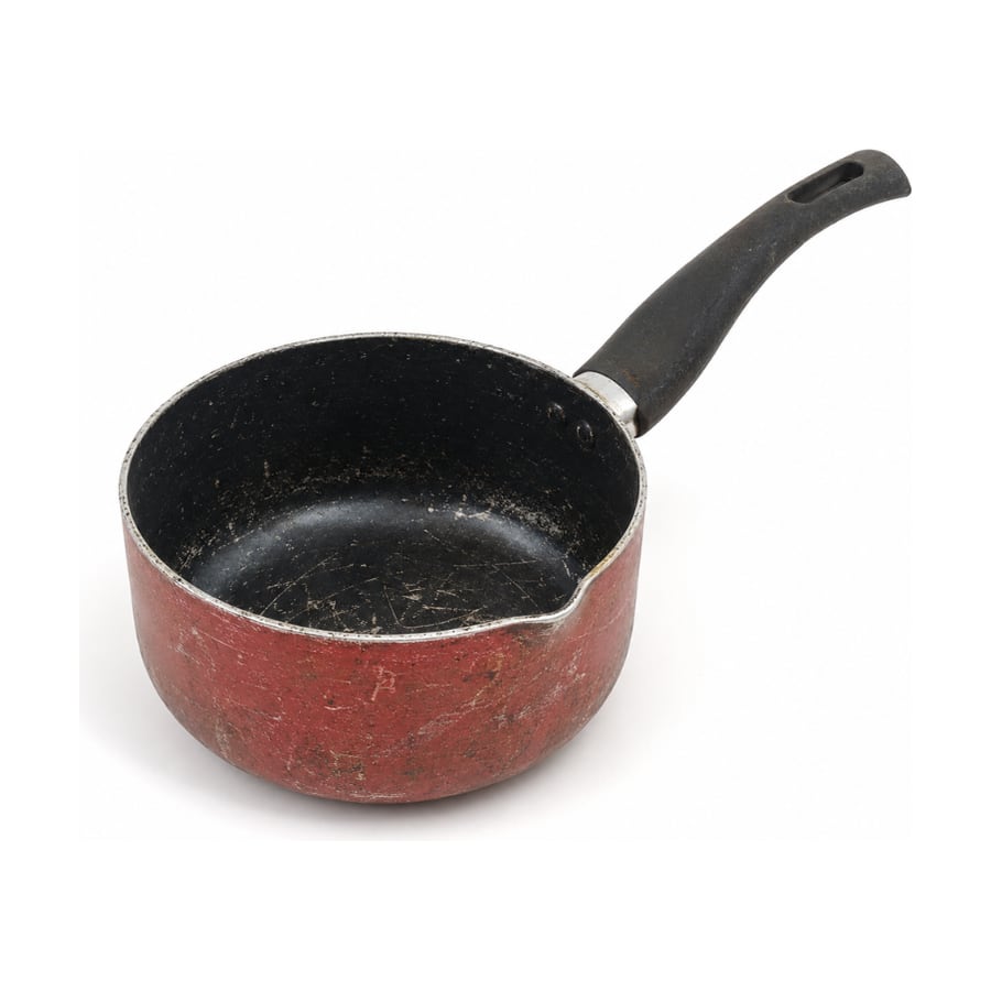Worn nonstick saucepan with a scratched coating