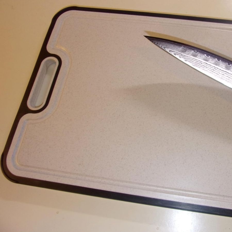The wheat-fiber side of the double-sided board with a knife