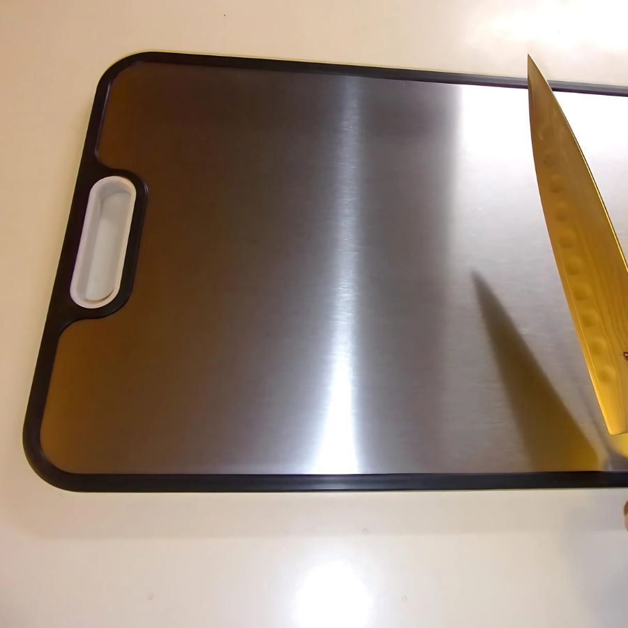 The titanium side of the double-sided board with a knife